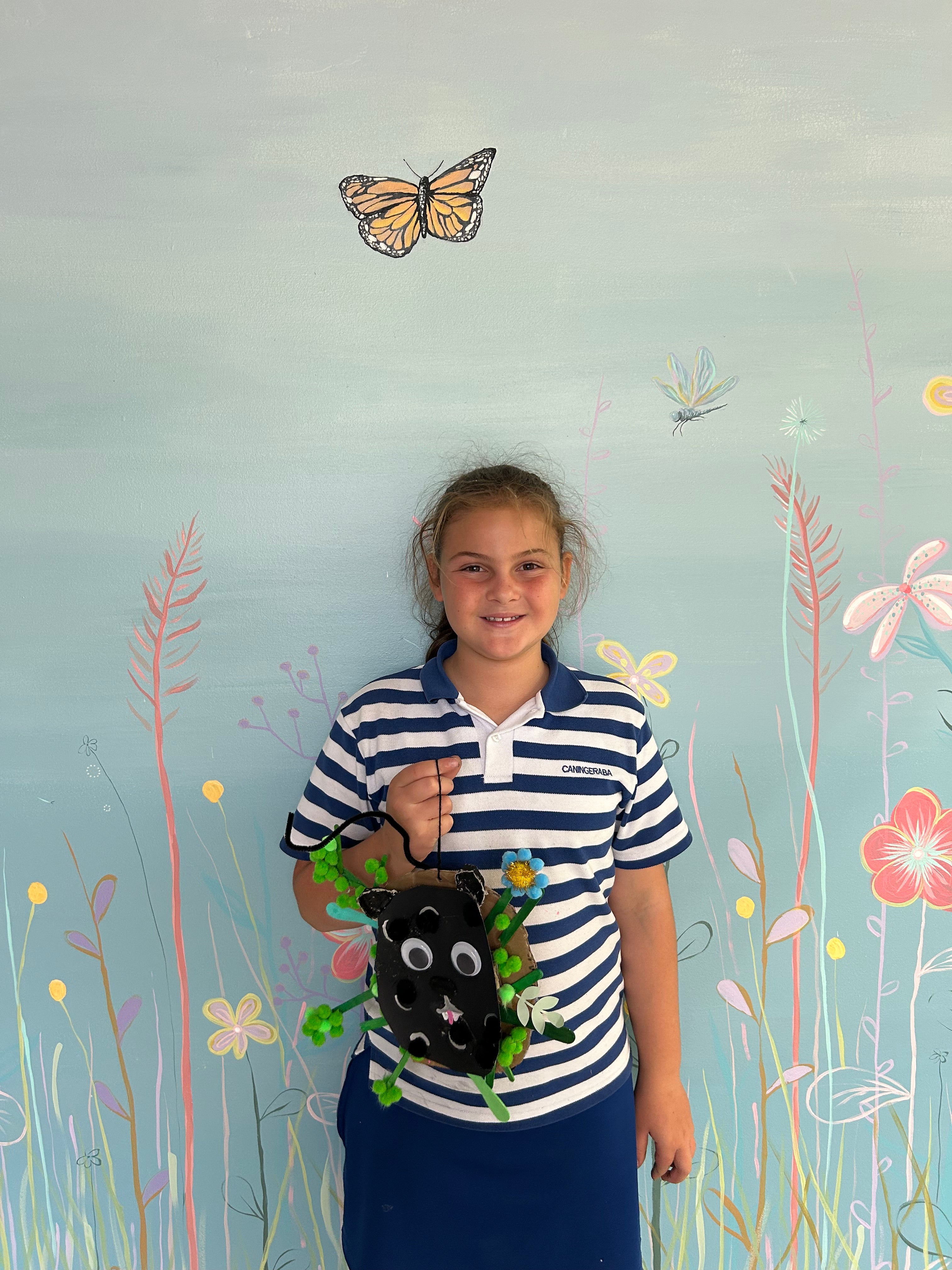 Child showing her artwork