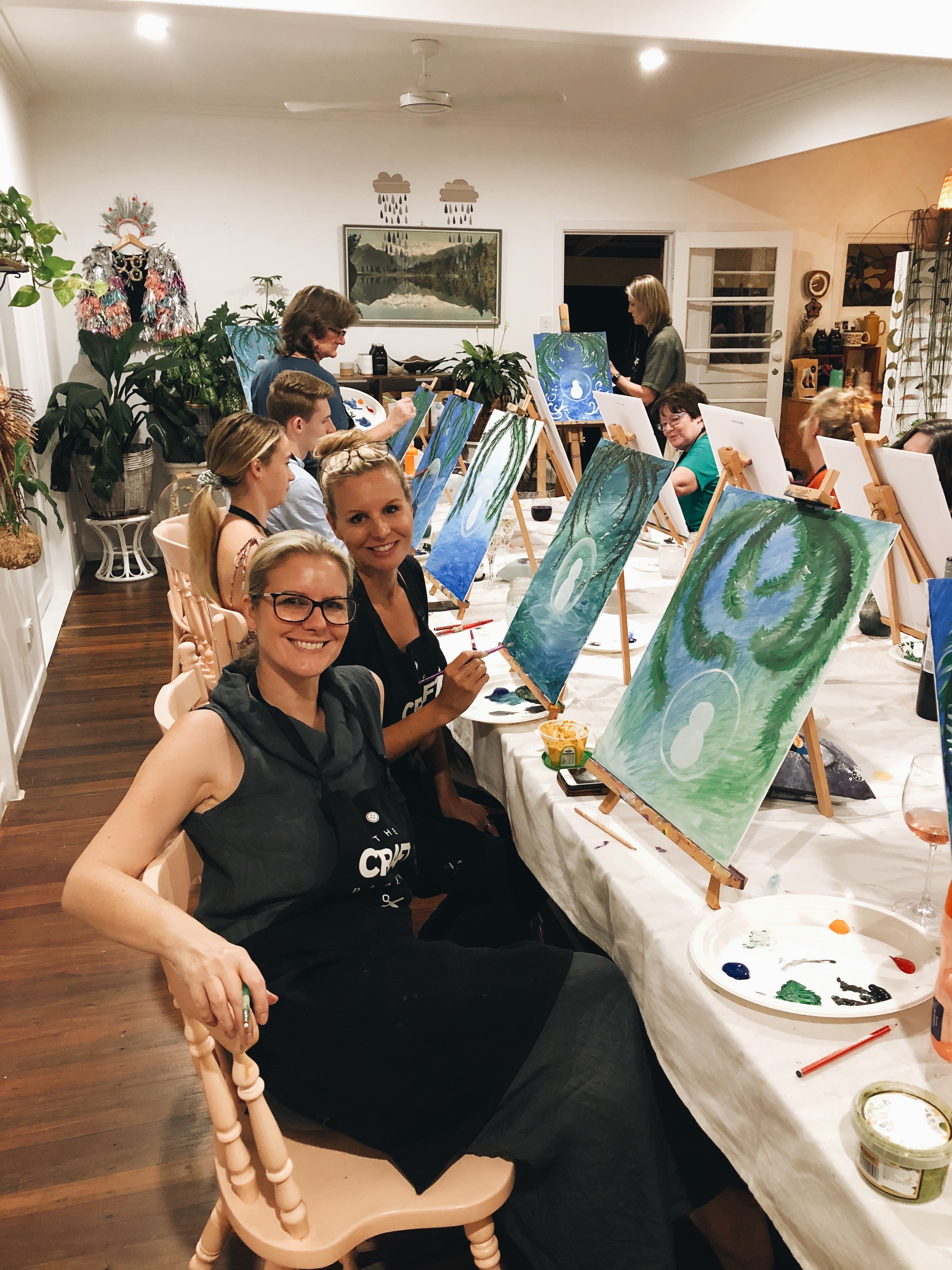Ladies painting at The Craft Parlour Christmas paint and sip workshop