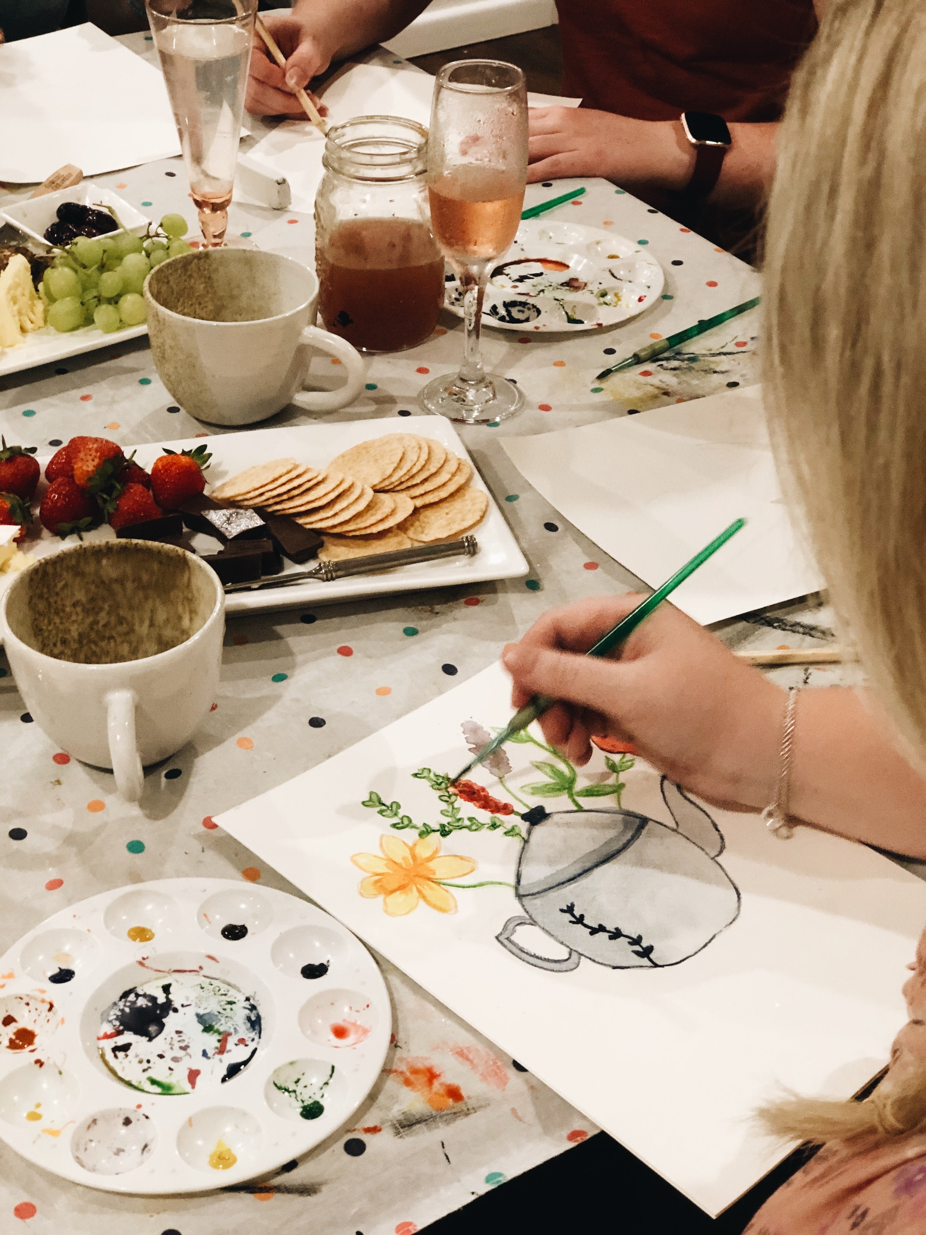 Girl painting teapot using watercolours at craft workshop on Gold Coast