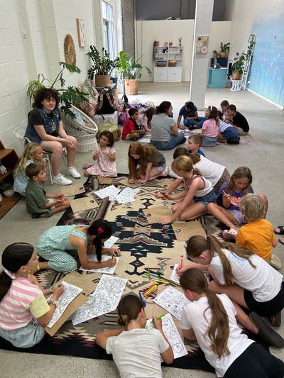 kids sitting on the floor before we start crafting