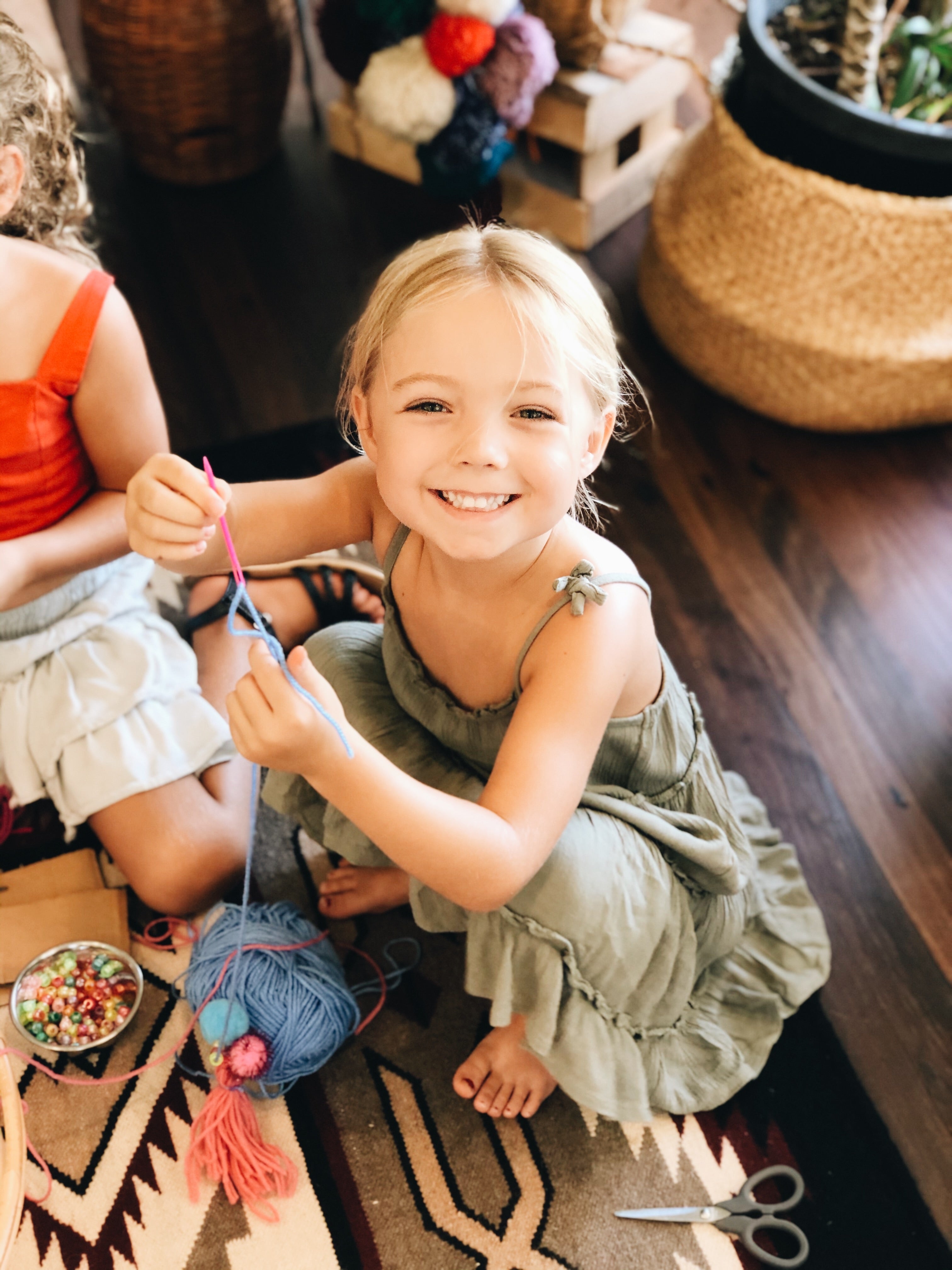 Smiling child at The Craft Parlour after school craft club