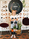 Happy child with kokedama string garden handmade at Gold Coast workshop