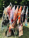 Lots of hand dyed pillowcases drying in the sun