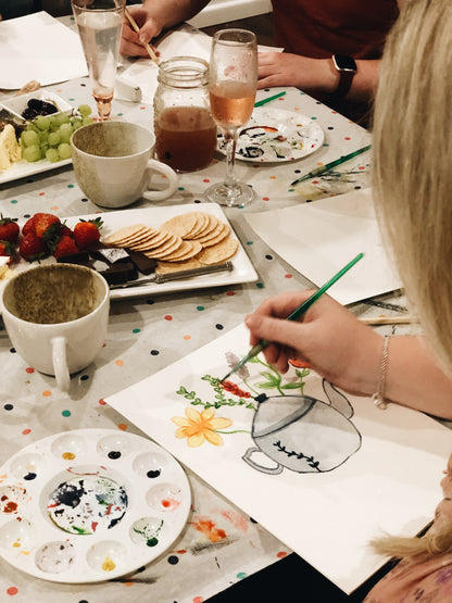 Girl painting teapot using watercolours at craft workshop on Gold Coast
